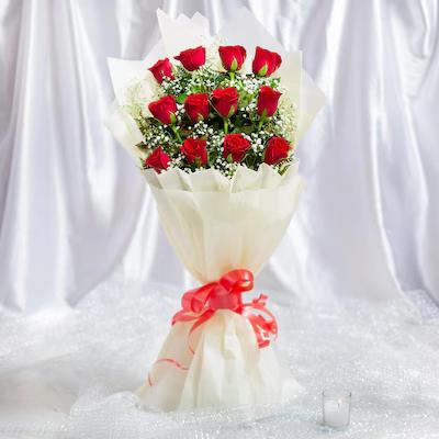 Classic Aura 12 Red Roses Bouquet Flower Type: Red Roses , No. of Stems: 12 , Fillers: Green Seasonal Fillers.