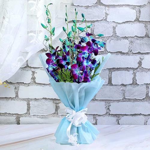 Romantic Tickle Flower Type: Blue Orchids , No. of Stems: 6 , Fillers: Green Seasonal Fillers. 